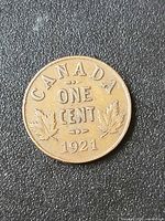 Reverse of 1921 Canada One Cent showing date and maple leaves