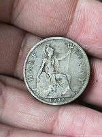 Reverse of 1928 UK half penny showing seated Britannia and date