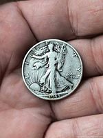 Obverse showing 1945 date and worn Liberty design