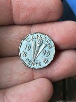 Reverse showing CANADA, 1945 date, Victory torch, maple leaves, denomination Cents