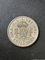Reverse side showing crowned Tudor rose design and legends