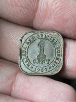Reverse of coin showing denomination, country and date