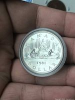 Obverse view of 1981 Canada dollar in capsule