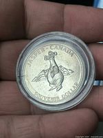 Obverse showing stylised animal and inscriptions