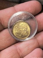 Obverse of 1983 Mexico 20 Pesos coin in capsule