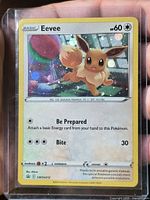 Front of Eevee SWSH212 holo card in sleeve