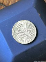 Coin overall view on blue surface