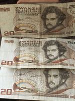 Three banknotes obverse showing portrait and denomination