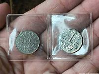 Obverse sides of 1936 and 1951 Canada 5 cent coins in flips