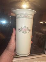 Side view of Lenox Charleston vase showing floral motif and gold rim