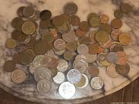 Top view of entire coin spread on marble surface