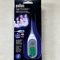 Front view of sealed Braun Age Precision digital thermometer packaging