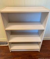 Front view showing three shelves in place