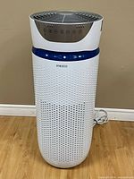 Full view of HoMedics tower air purifier standing on floor