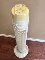 Full view of Likewise tower fan on base showing overall condition
