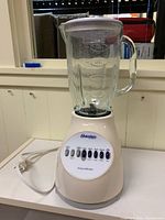 Complete assembled blender showing base, jar and lid