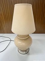 Full view of lamp showing base, shade, and cord