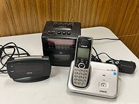 All three electronic items grouped together showing overall condition