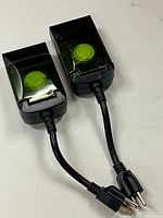 Both Woods timers showing cords and covers