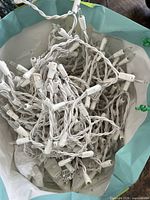 White icicle string lights bundled in bag