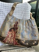 Front view of leather handbag with Klimt Hygieia print and gathered top