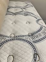 Close-up of mattress top showing pattern and tufting