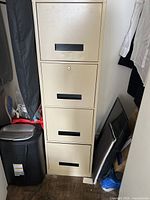 Full view of beige 4-drawer filing cabinet