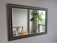 Front view of rectangular mirror on wall