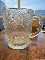 Side view of textured glass pitcher