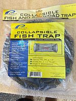 Front of sealed package showing Promar TR-503 collapsible fish trap label