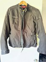 Front view of Teknic motorcycle jacket on hanger