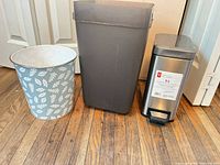Three trash cans side by side showing size, shape, colors