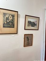 All three framed prints hung on wall