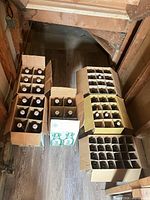 Overhead view of five cardboard cases containing assorted beer bottles