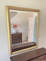 Front view of rectangular wall mirror on wall