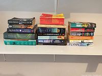 Two stacks of books showing spines and titles