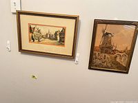 Front view of both framed prints on wall
