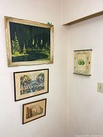 Wall view showing oil painting, two prints and key cabinet for scale and framing