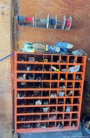 Cabinet with compartments filled with hardware