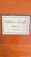 Front view of ceramic tile sign showing text and coloration
