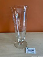 Full view of vase beside sugar packet for scale