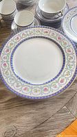 Stacked plates, showing floral cobalt gold pattern