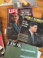 Stack showing Life, JFK Memorial Album and Look Viet Showdown