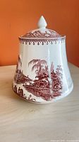 front view showing scenic transferware design and lid