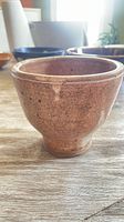 Front view of brown speckled stoneware pot
