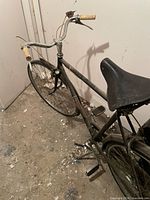 Full view of bicycle from front left side showing frame, handlebars, saddle, front wheel