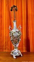 Full view of porcelain urn lamp showing height, handles, base, and brass socket