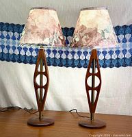 Both teak lamps side by side showing full design and shades