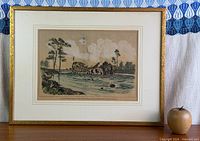 Full view of framed engraving on tabletop