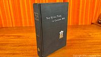 Front cover of the hardcover book showing title and crest